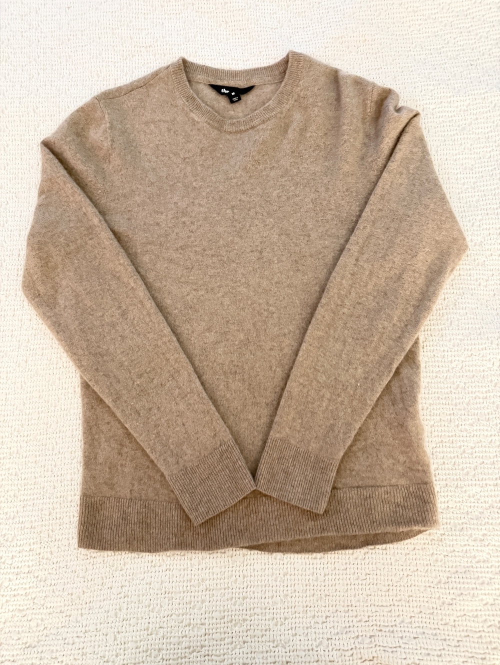 The Group beige crewneck sweater